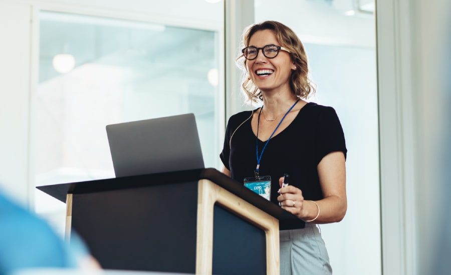 female speaker in a conference